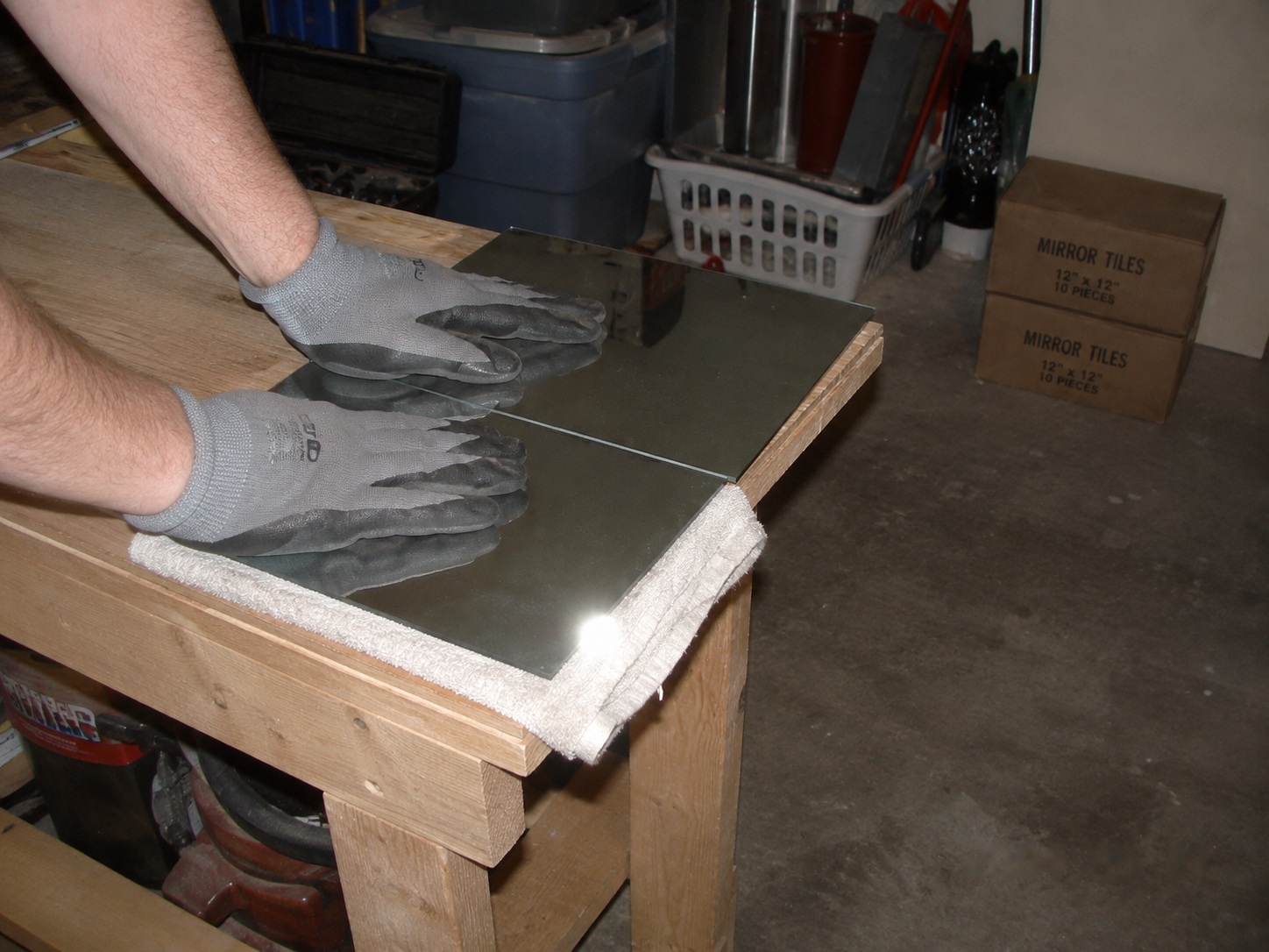 Score line on the padded bench edge — press down and it parts clean.